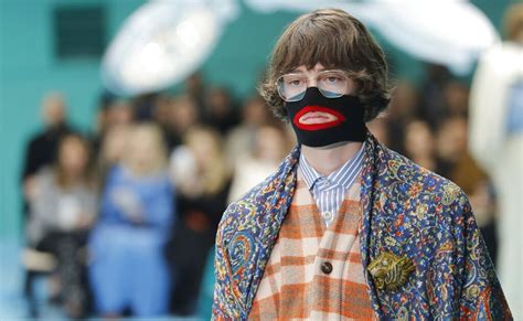 gucci pulled a black polo neck sweater|Gucci pulls polo neck after 'blackface' claims .